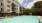 a swimming pool in front of a building