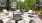 a group of white chairs outside