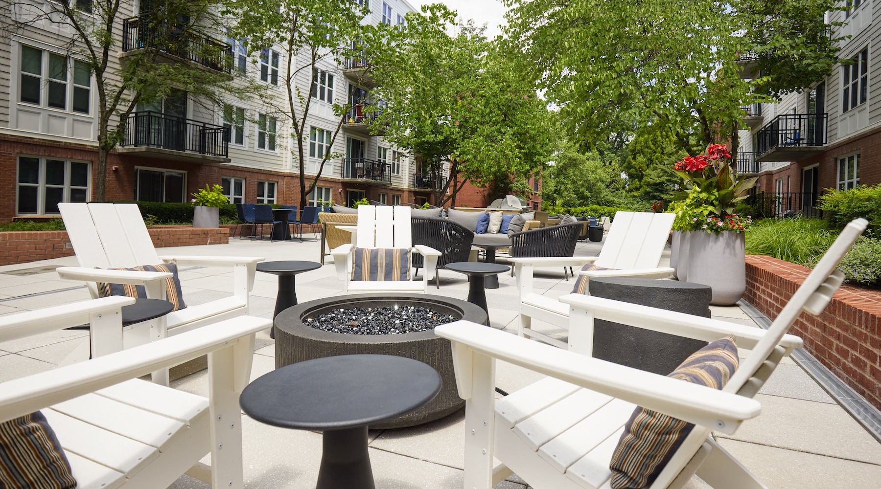 State-of-the-art amenities a courtyard with chairs and a table