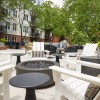 a courtyard with chairs and a table
