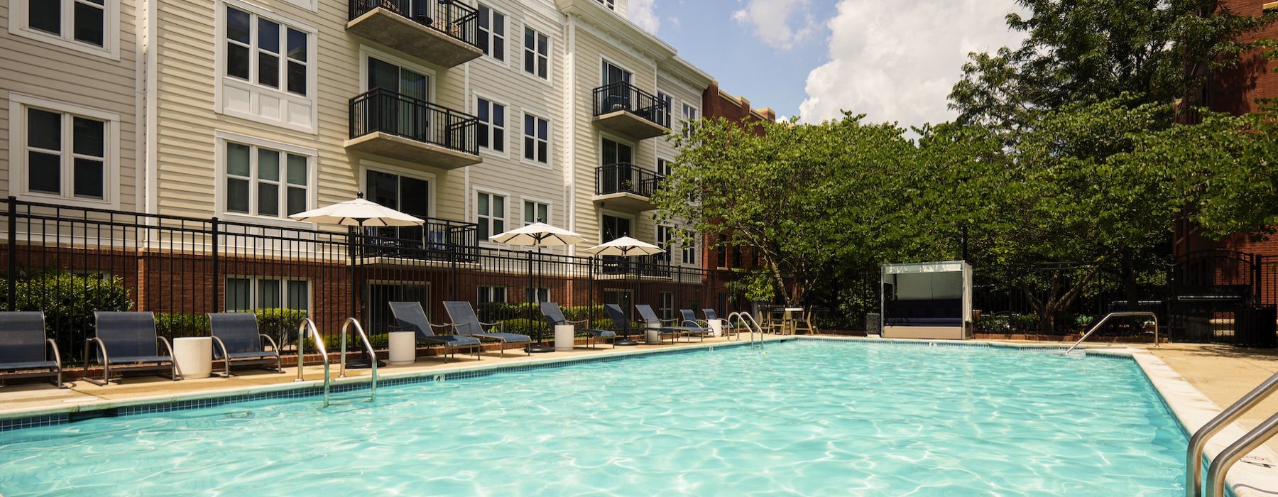 a swimming pool in front of a building