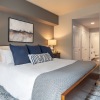 a bedroom with a bed and two nightstands