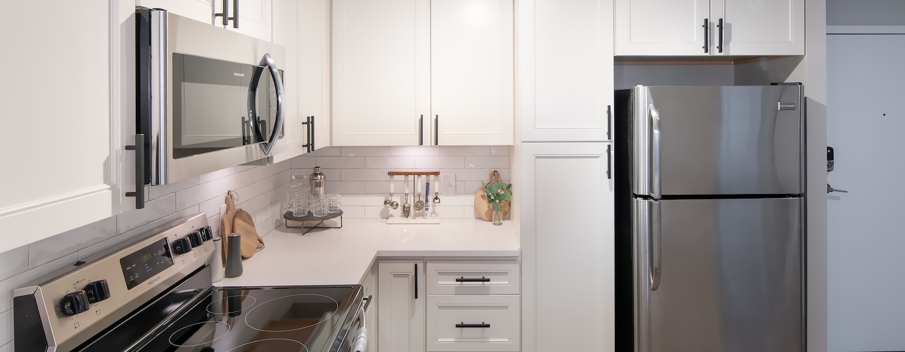 a kitchen with white cabinets