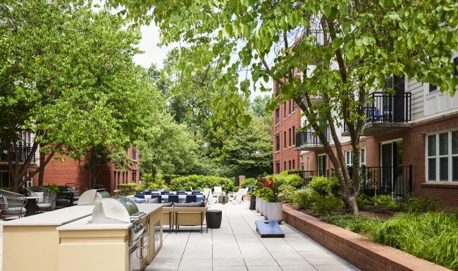 State-of-the-art amenities a courtyard are with grills, tables and chairs