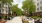 a courtyard with chairs and tables and trees
