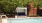 a swimming pool with a metal gate